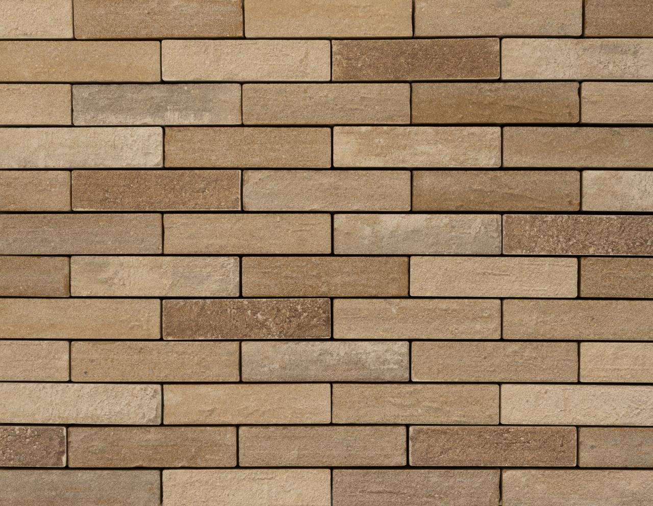 Beige und braune Backsteinmauer mit rechteckigen Steinen
