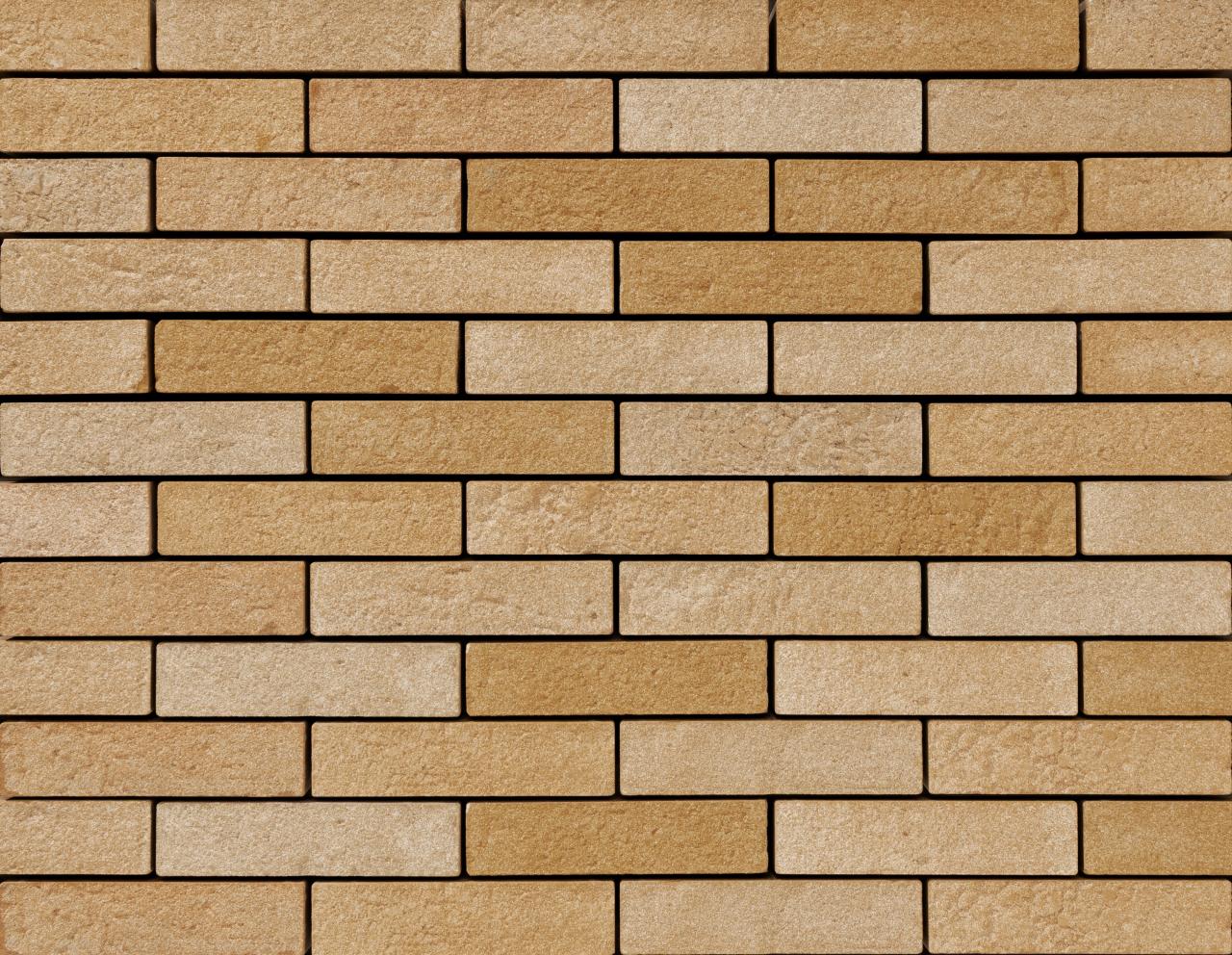 Hellbraune Ziegelwand mit regelmäßigem Muster