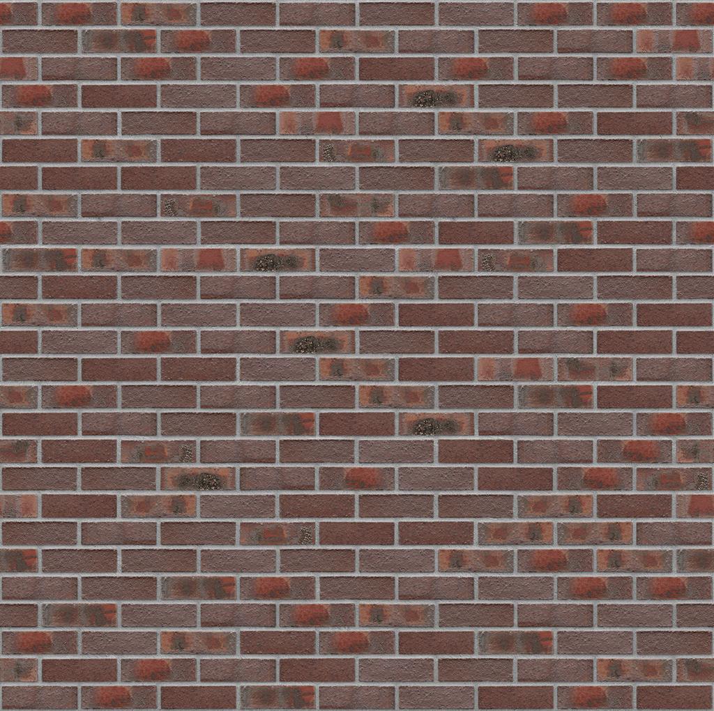 Rote Backsteinmauer mit unregelmaessigen dunklen Flecken