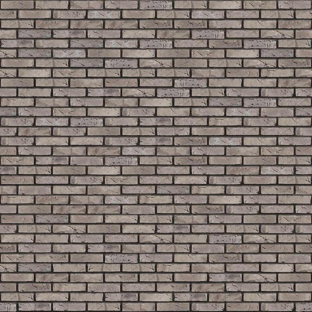 Graue Backsteinmauer mit regelmäßigen Fugen