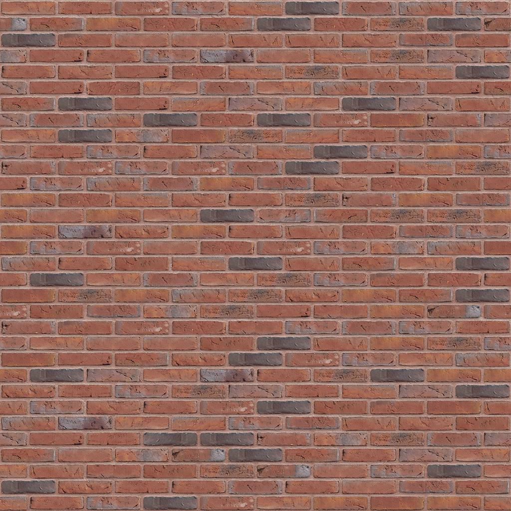 Rote Backsteinmauer mit vereinzelten dunkleren Steinen