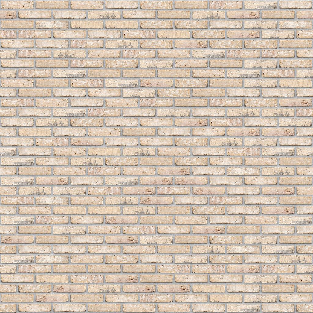 Hellbeige Ziegelsteinmauer mit gleichmaessigen Fugen