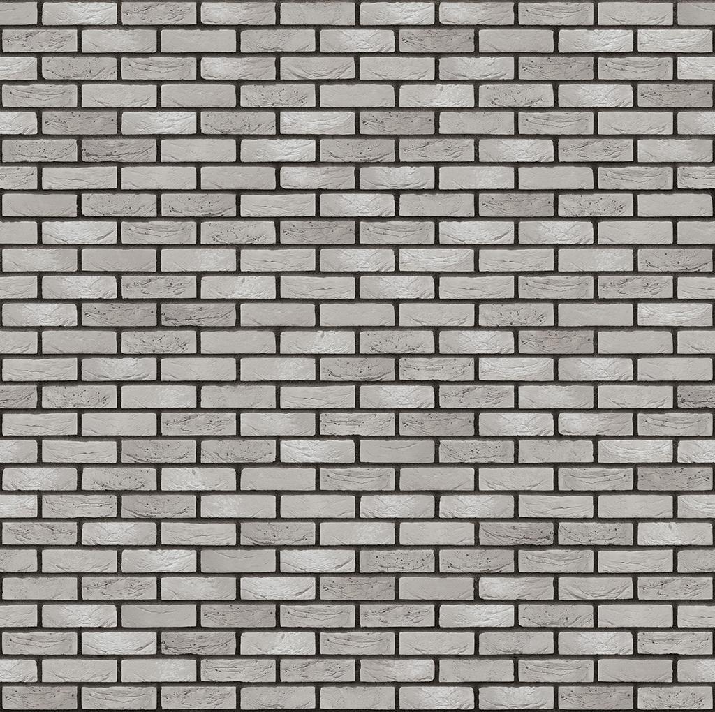 Graue Ziegelsteinmauer in regelmäßigem Muster